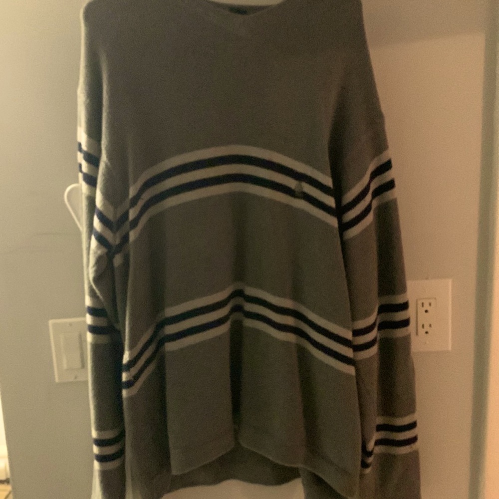 Gray sweater with black and white stripes